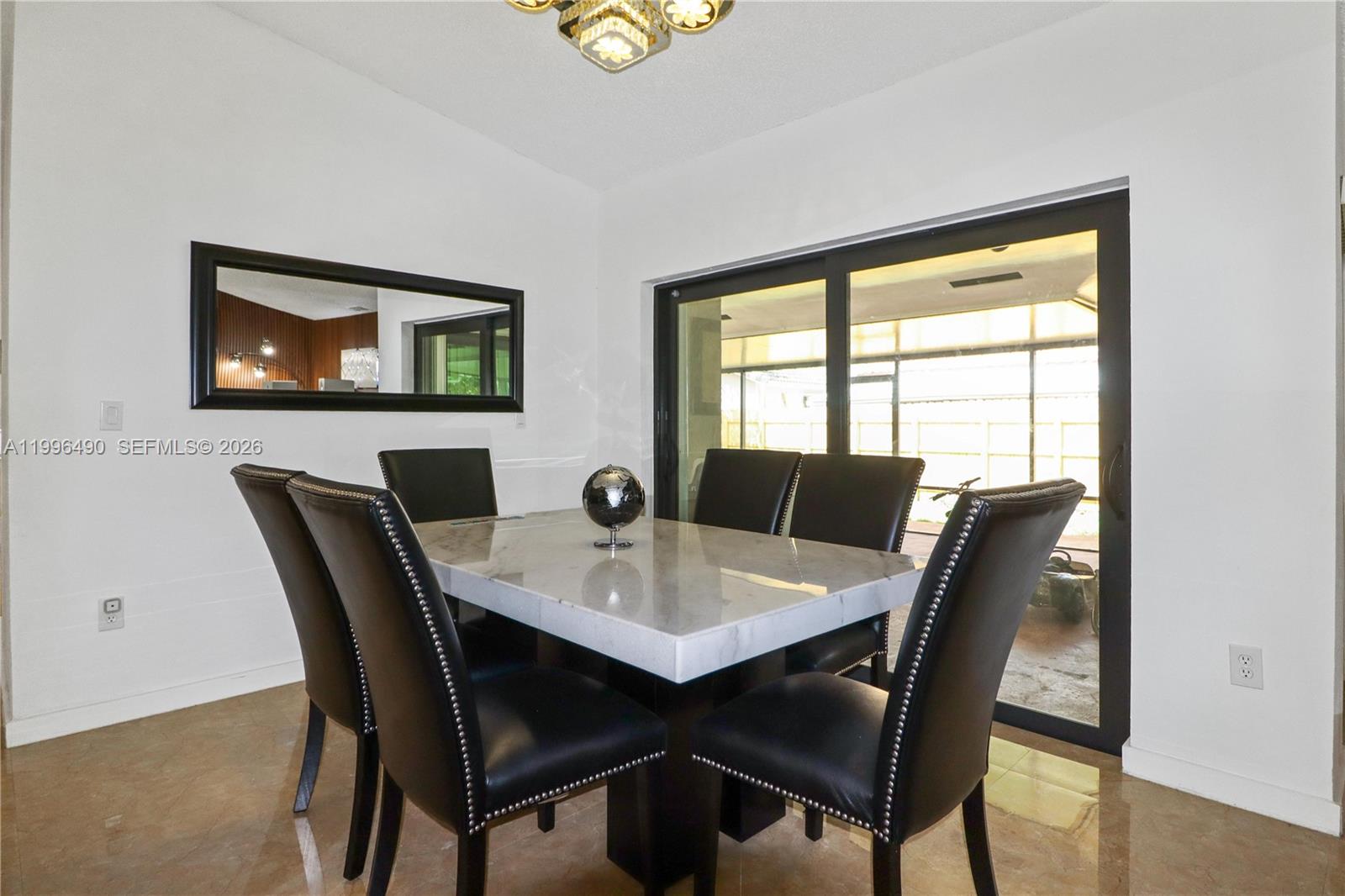 10940 Southwest 143rd Court Miami, FL 33186 - Photo 7 of 31 a view of a dining room with furniture and window