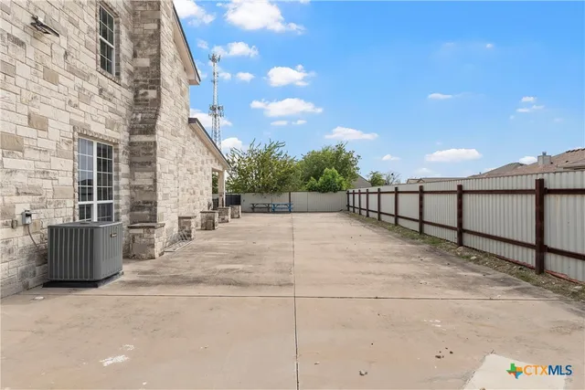 a view of backyard with sitting area