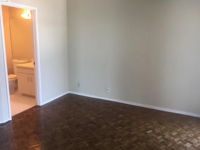 a view of an empty room and a window