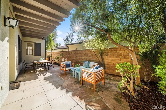 a outdoor dining space with furniture and a potted plant