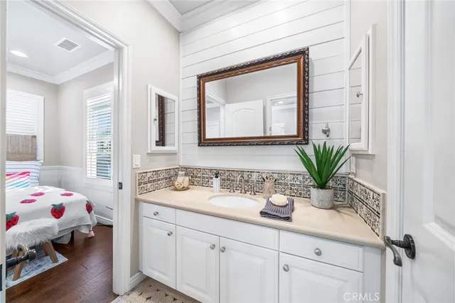 a bed room with a bed a couch and a window