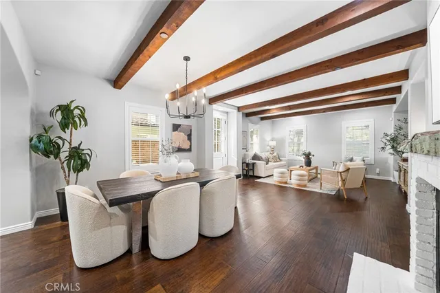 a kitchen with a stove cabinets and living room view