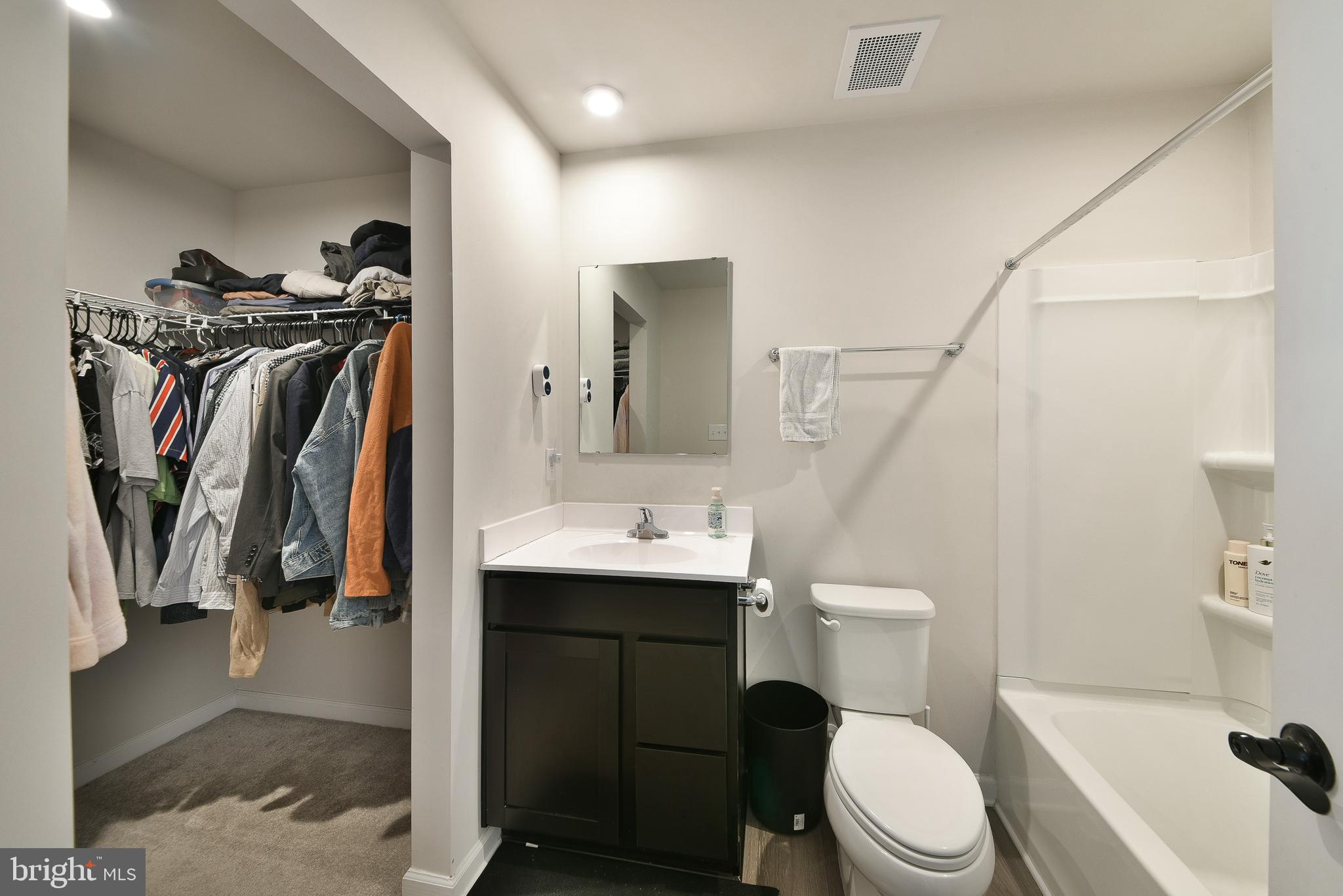 24 Wendowski Street Beverly, NJ 08010 - Photo 11 of 19 a bathroom with a sink a toilet and a mirror