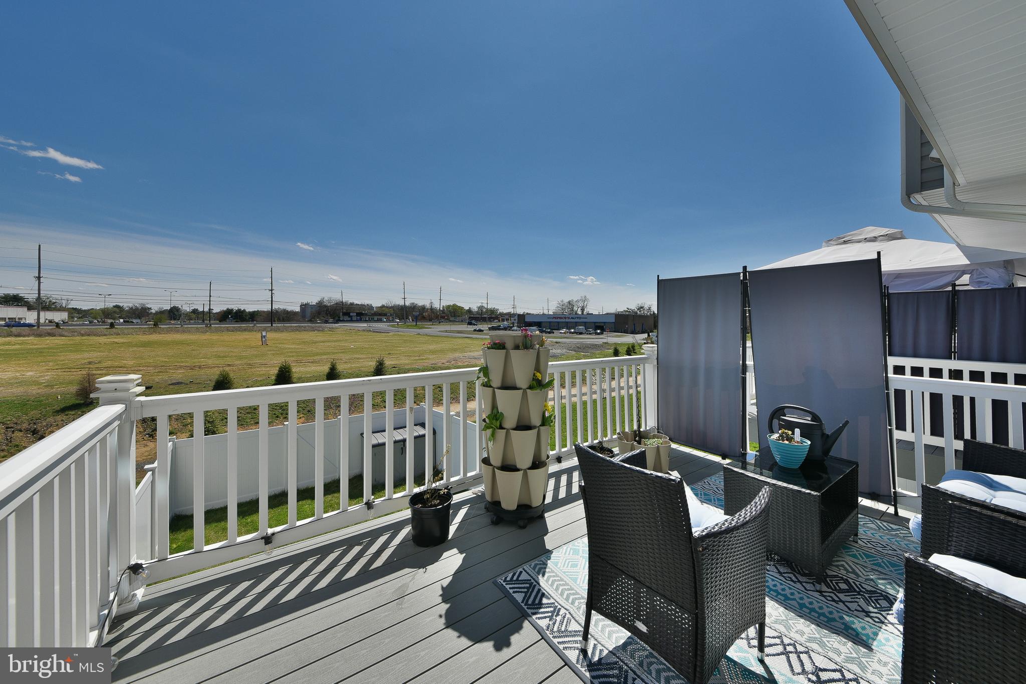 24 Wendowski Street Beverly, NJ 08010 - Photo 17 of 19 a view of a balcony with chair and wooden floor