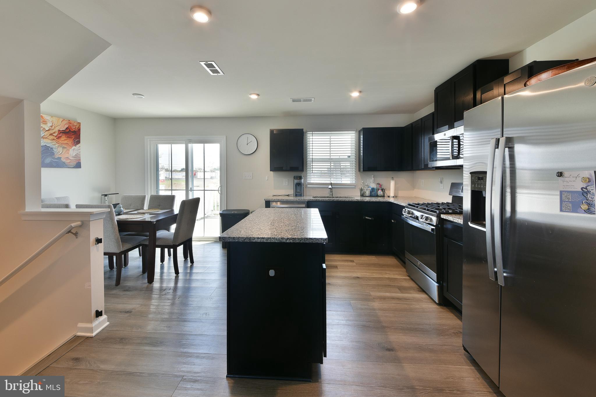 24 Wendowski Street Beverly, NJ 08010 - Photo 6 of 19 a kitchen with stainless steel appliances granite countertop a refrigerator a sink a stove and wooden cabinets