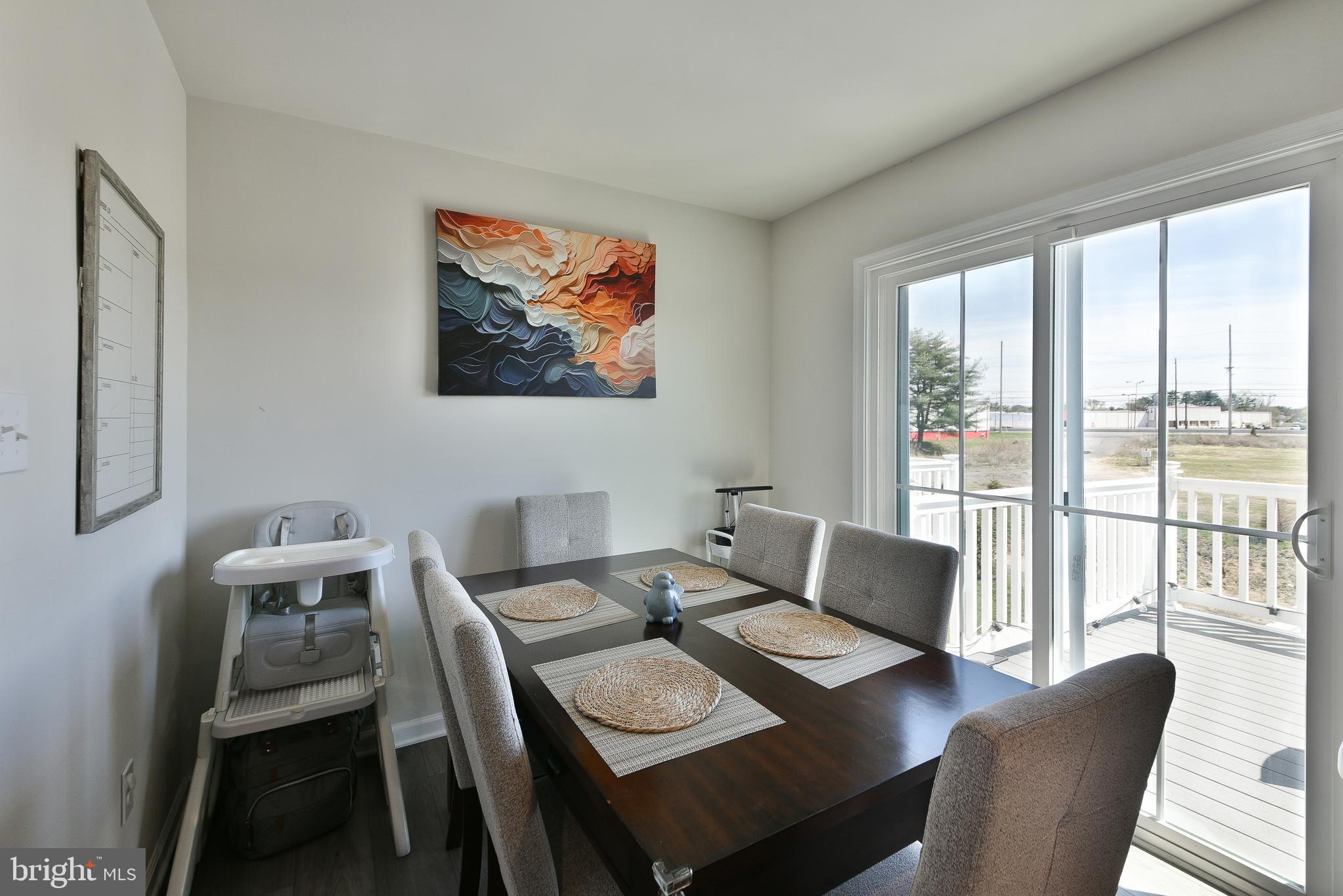 24 Wendowski Street Beverly, NJ 08010 - Photo 8 of 19 a view of a dining room with furniture a rug and wooden floor