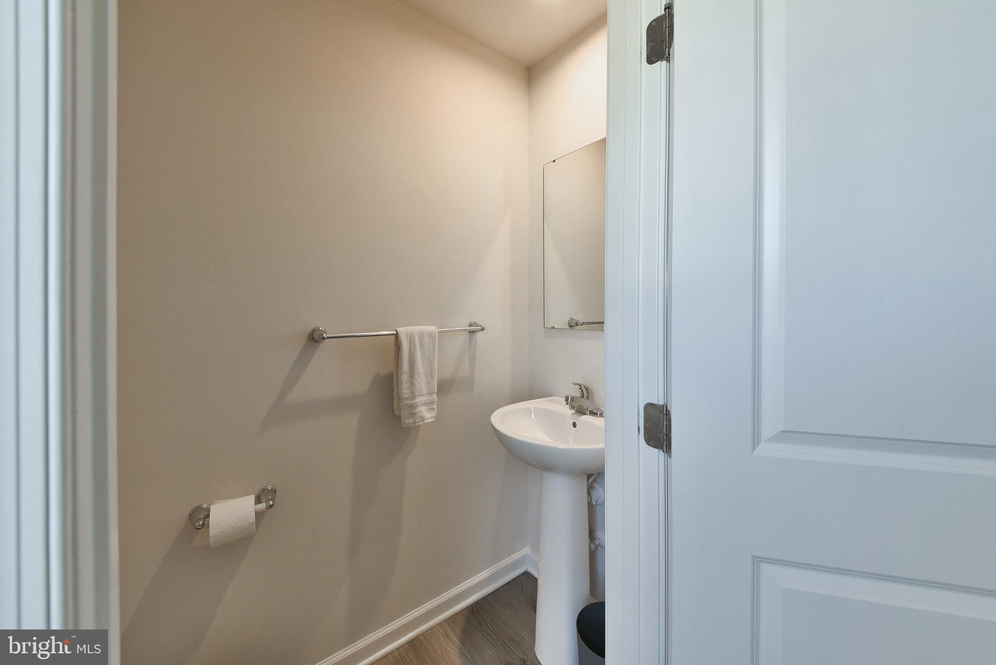24 Wendowski Street Beverly, NJ 08010 - Photo 9 of 19 a bathroom with a sink
