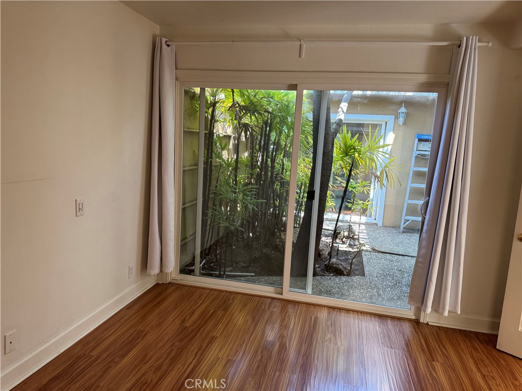39 Bethany Drive Irvine, CA 92603 - Photo 2 of 37 a view of a room with wooden floor and glass door