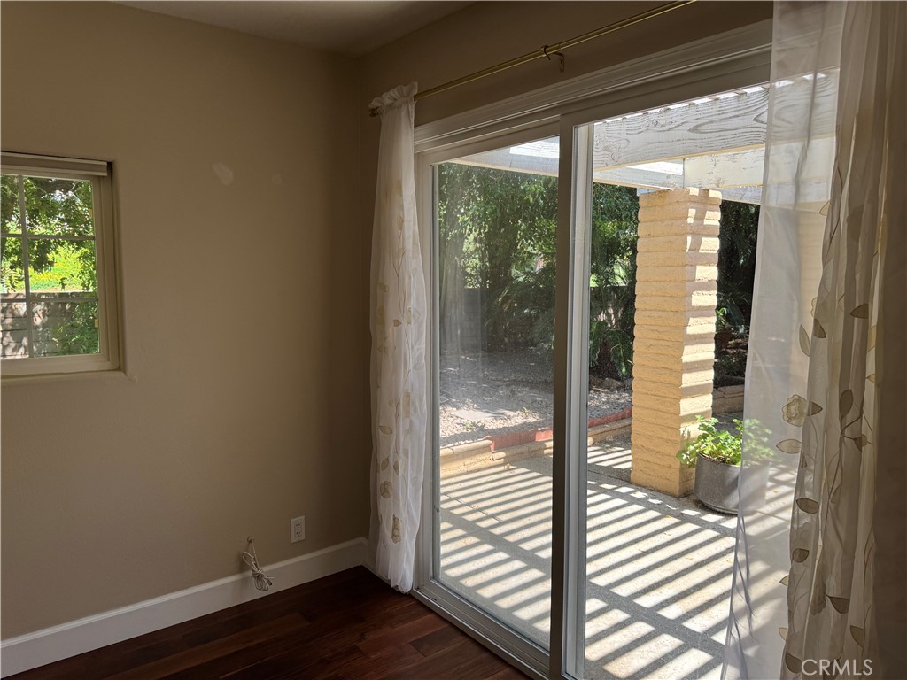 39 Bethany Drive Irvine, CA 92603 - Photo 31 of 37 a view of a hallway with wooden floor and a floor to ceiling window