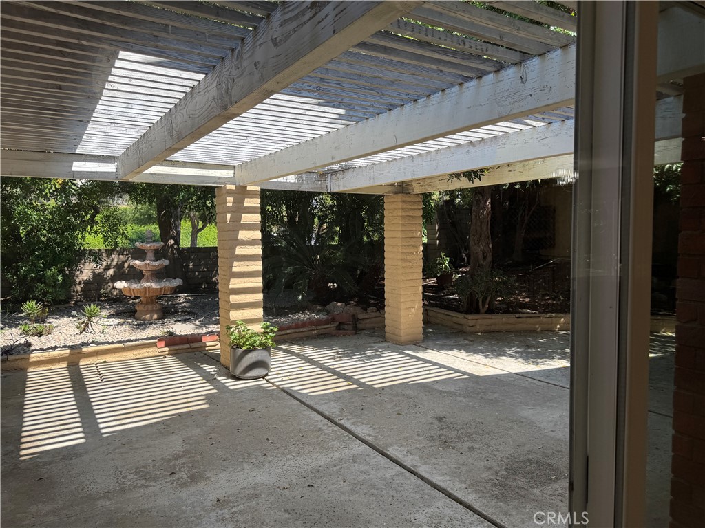 39 Bethany Drive Irvine, CA 92603 - Photo 32 of 37 a view of a patio with table and chairs and potted plants