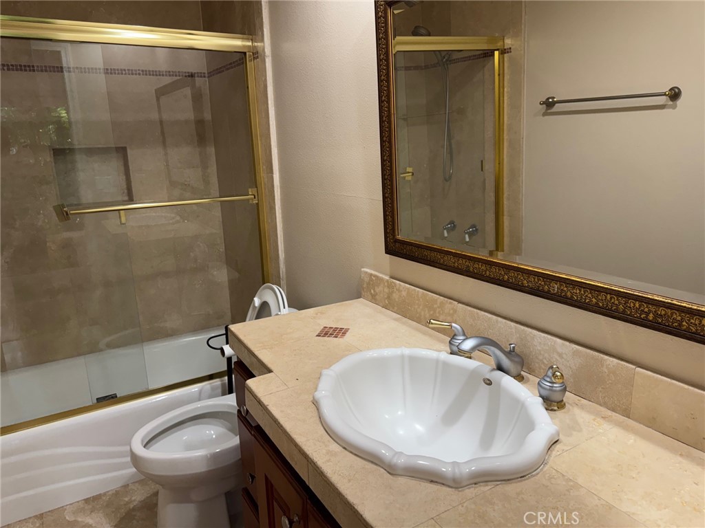 39 Bethany Drive Irvine, CA 92603 - Photo 5 of 37 a bathroom with a sink toilet and shower