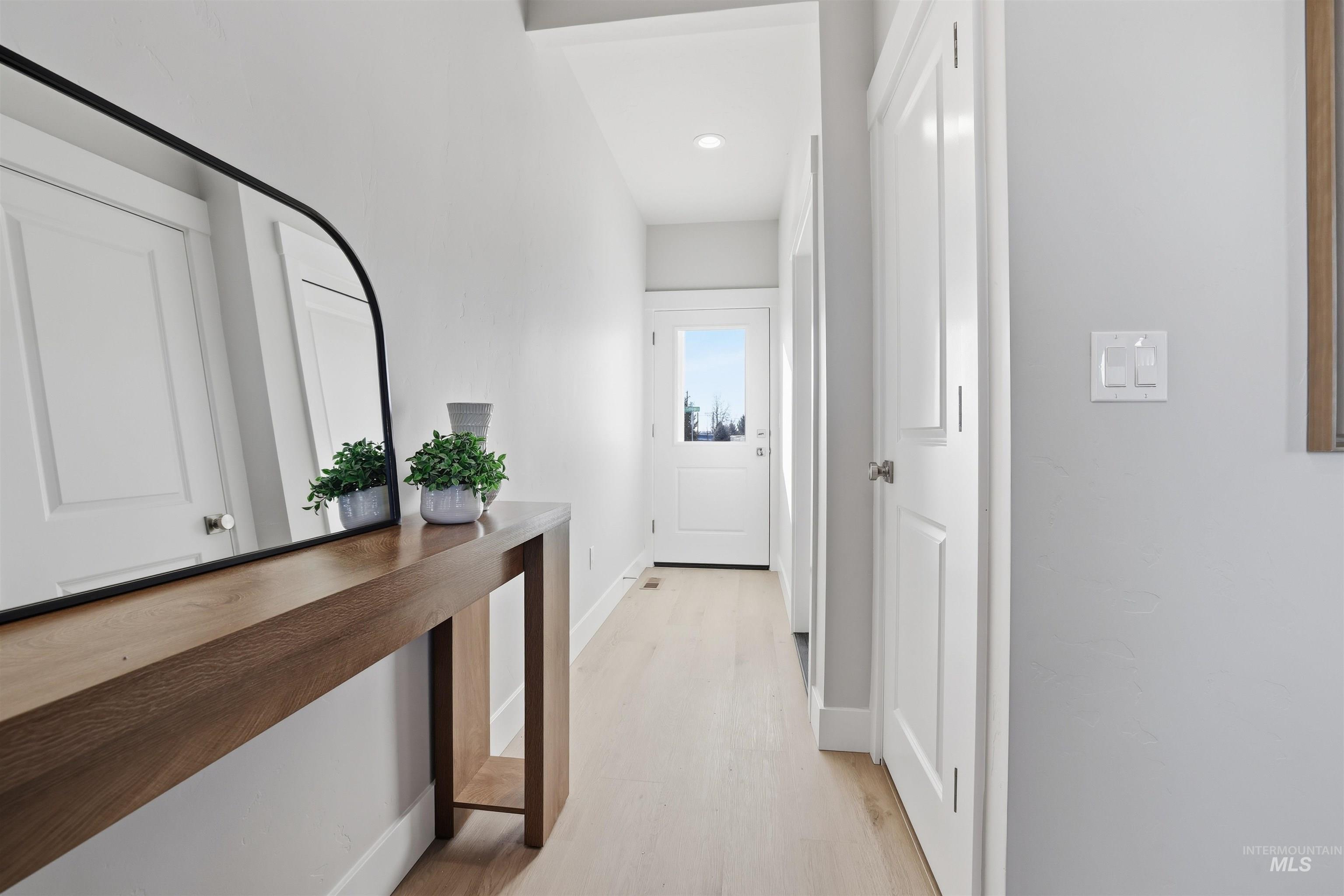 1172 East Cottage Street Kuna, ID 83634 - Photo 3 of 22 Hall featuring baseboards and light wood-type flooring