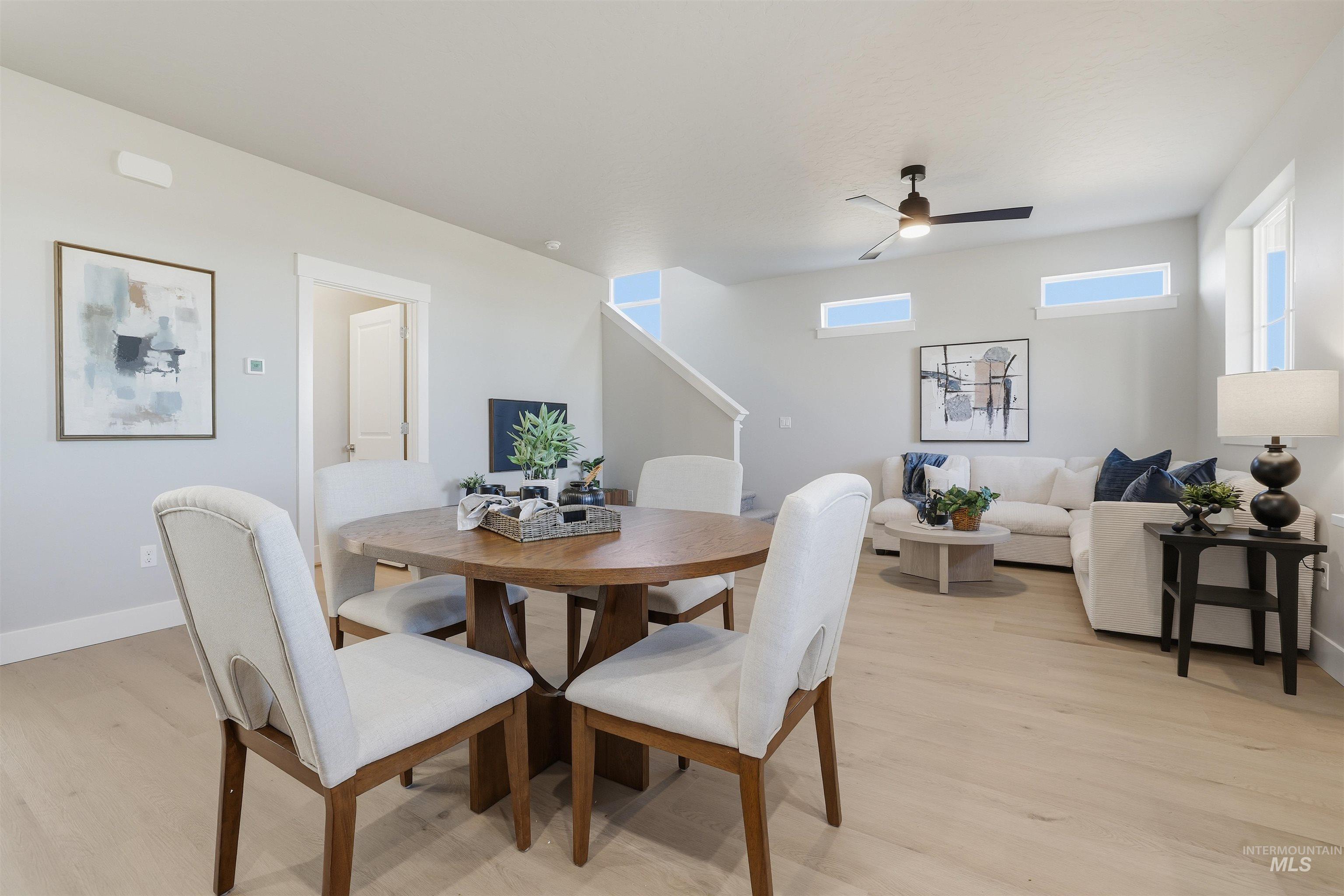 1172 East Cottage Street Kuna, ID 83634 - Photo 4 of 22 Dining area with light wood finished floors and a ceiling fan