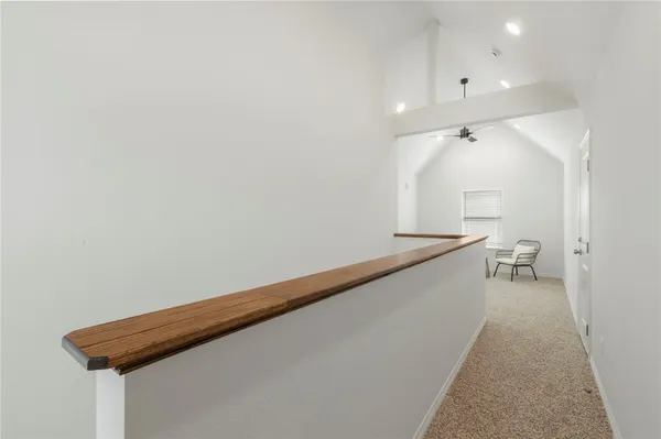 a view of a balcony with furniture
