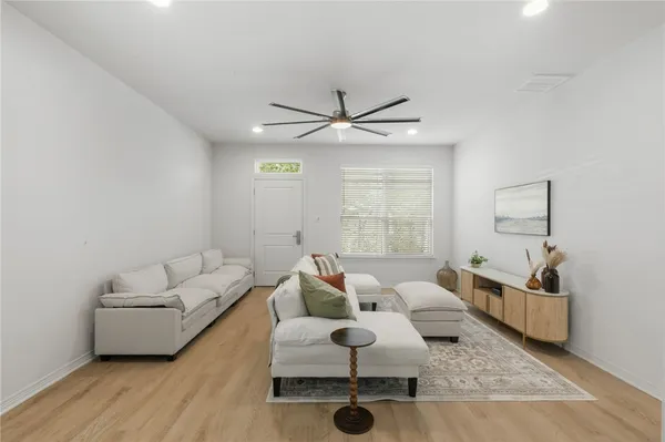 a living room with furniture and a large window
