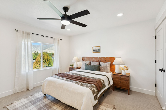 51 East 200 North, Unit 3 Bountiful, UT 84010 - Photo 18 of 27 Bedroom featuring light carpet, ceiling fan, a closet, a mountain view, and recessed lighting