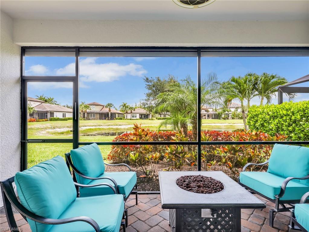 4383 Bismark Way Naples, FL 34119 - Photo 11 of 49 Screened In Lanai with Lake View, Paver Flooring, AHT Electric Screen, & Upgraded Landscaping