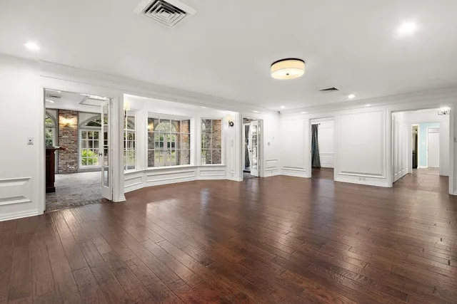 a bedroom with a large bed and a large window