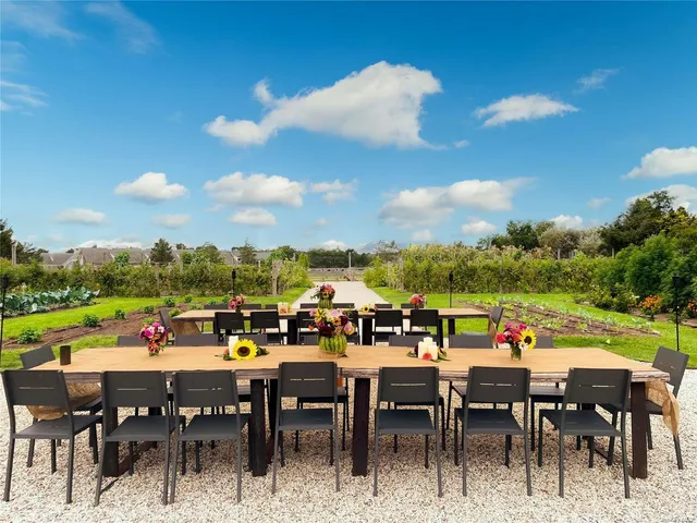 a view of a dining space with furniture fire pit and garden view