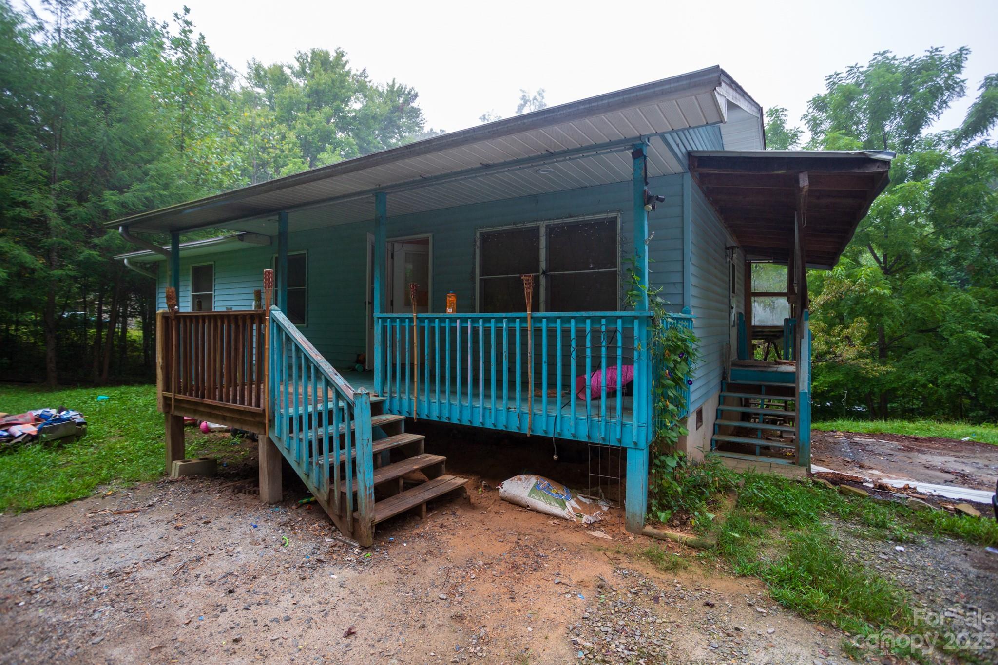 88 Adams Drive Brevard, NC 28712 - Photo 11 of 20 a view of a house with a yard and deck