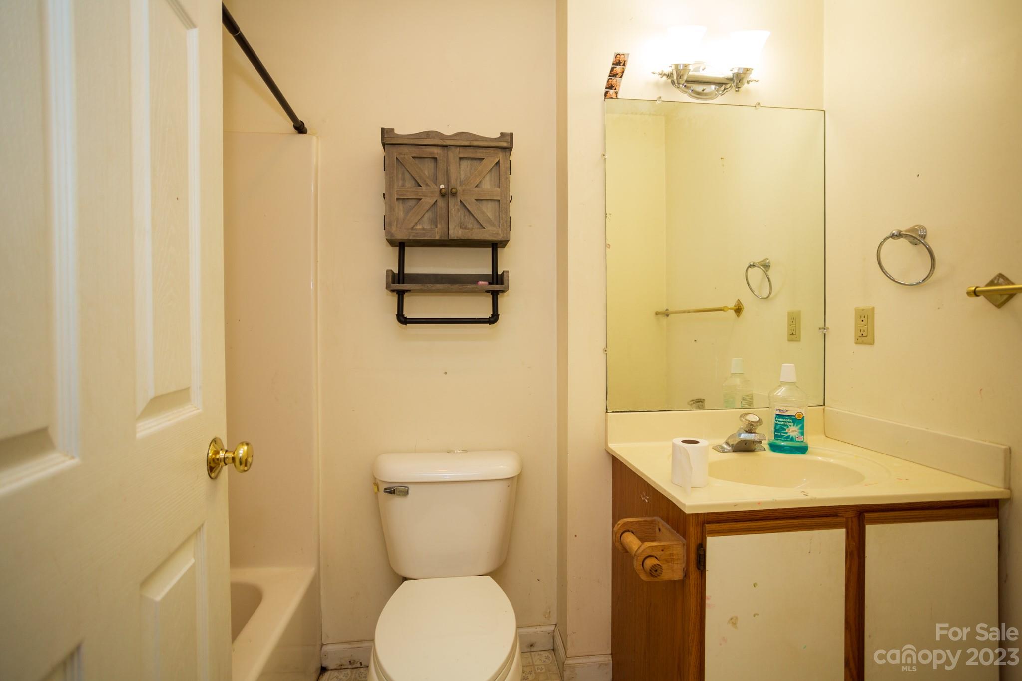 88 Adams Drive Brevard, NC 28712 - Photo 14 of 20 a bathroom with a sink a toilet and shower