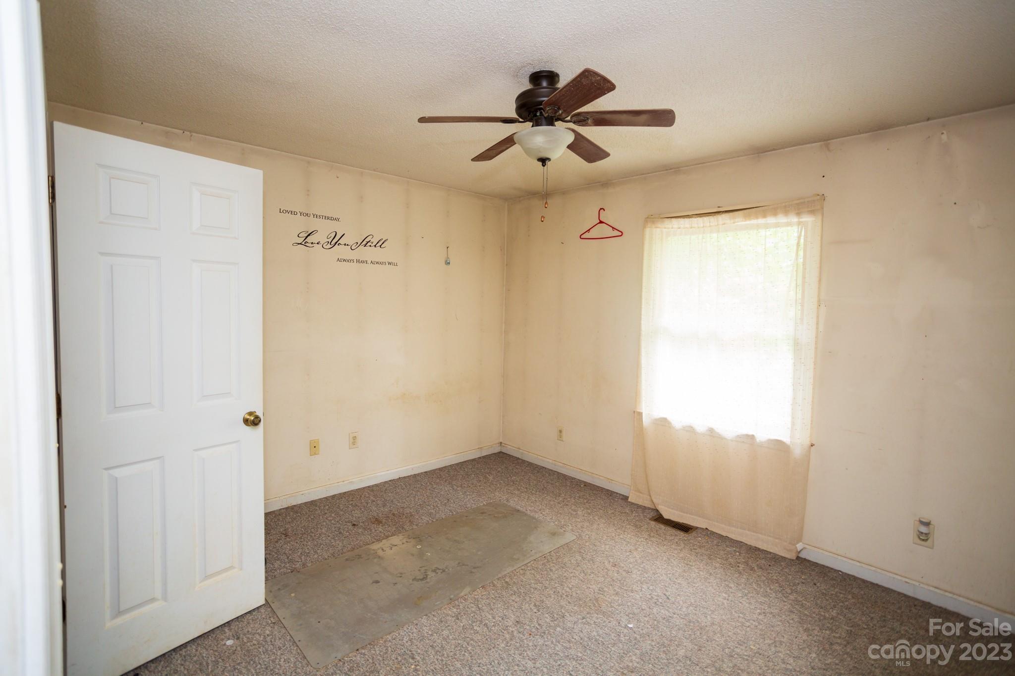 88 Adams Drive Brevard, NC 28712 - Photo 20 of 20 a view of an empty room and a window