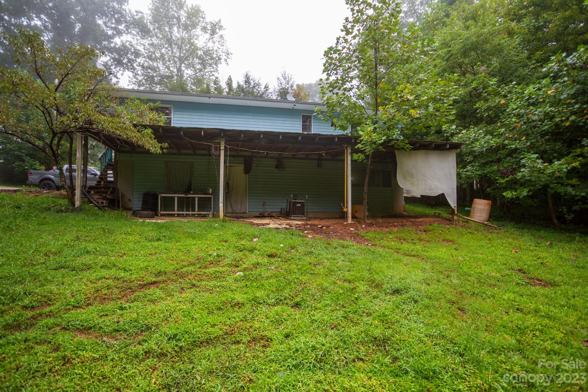 88 Adams Drive Brevard, NC 28712 - Photo 5 of 20 a view of a house with backyard and a tree