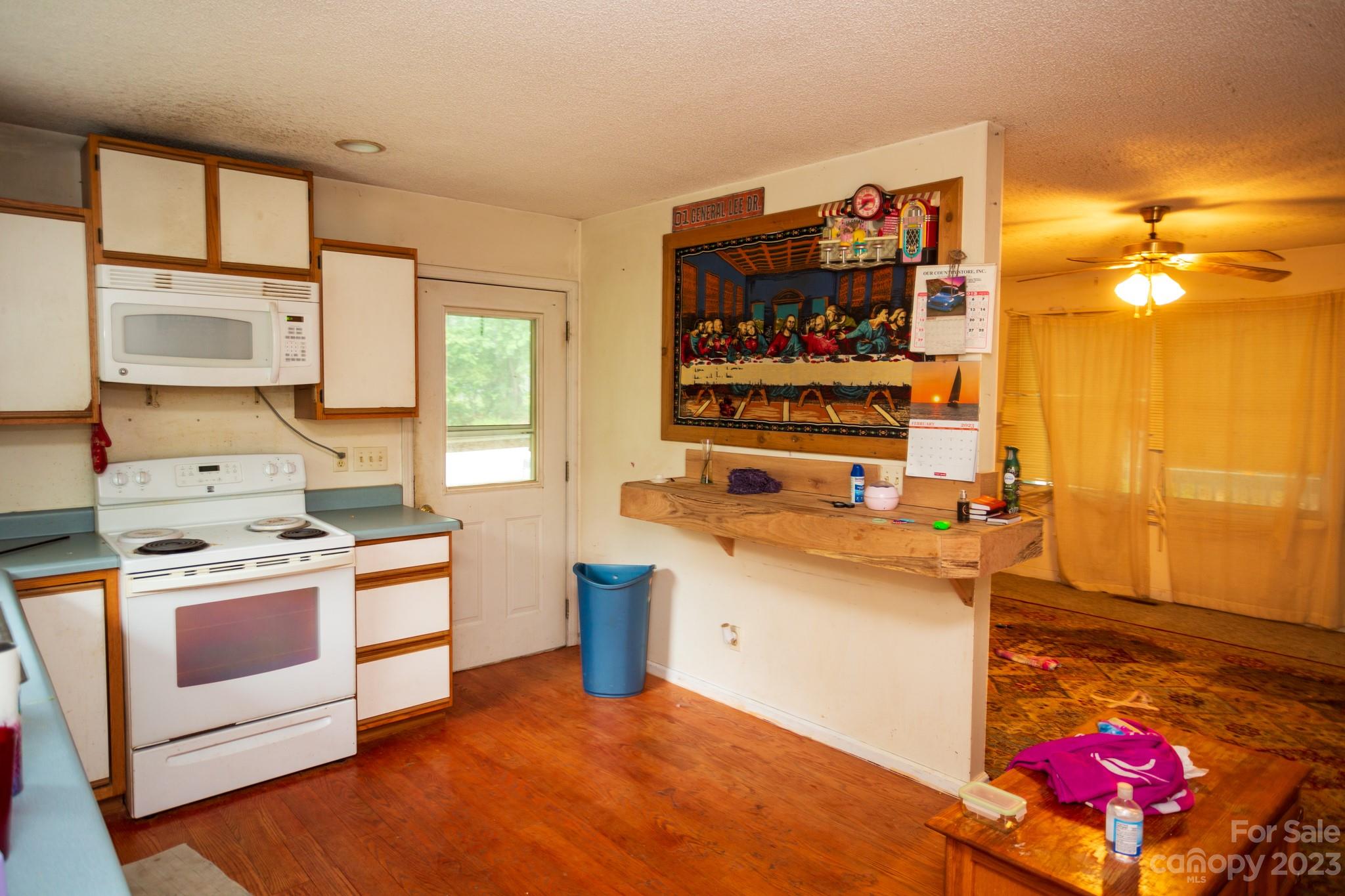88 Adams Drive Brevard, NC 28712 - Photo 8 of 20 a kitchen with stainless steel appliances granite countertop a stove and a sink