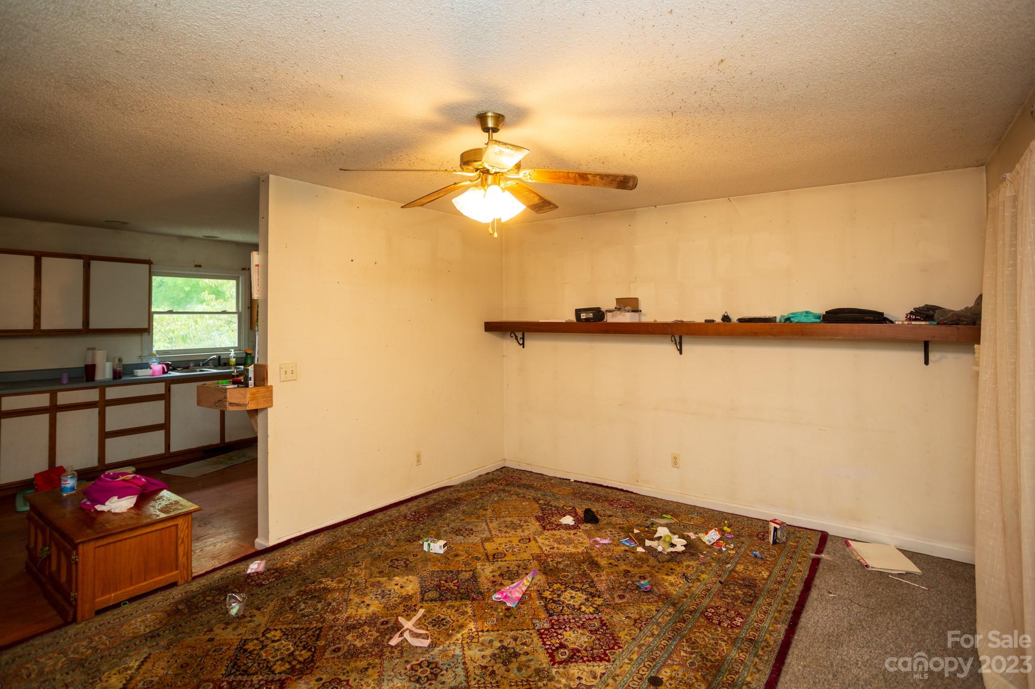 88 Adams Drive Brevard, NC 28712 - Photo 10 of 20 a view of a room with rack and wooden floor