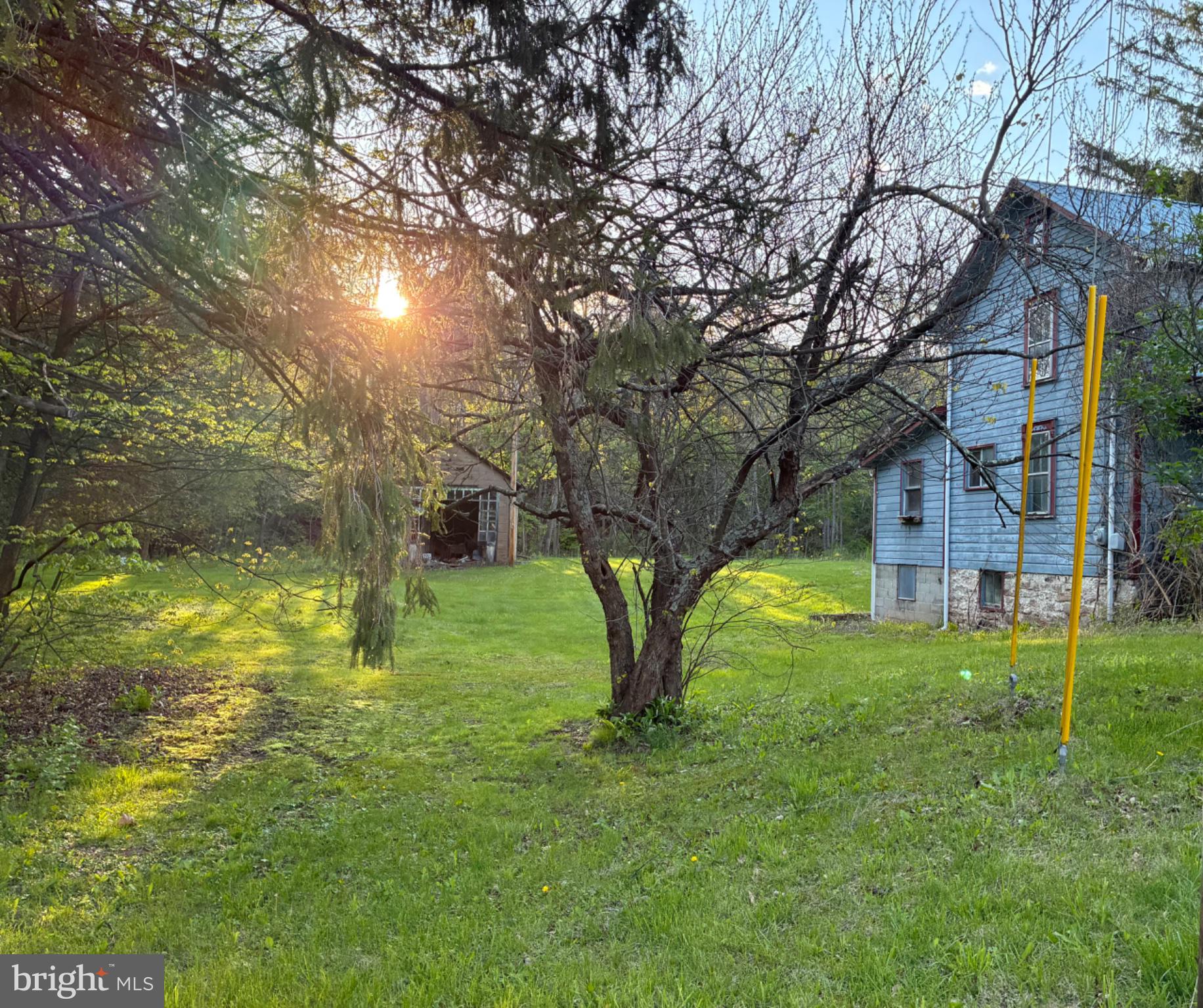 201 Hoover Road Robertsdale, PA 16674 - Photo 7 of 22 Sunset glow over a tranquil yard.