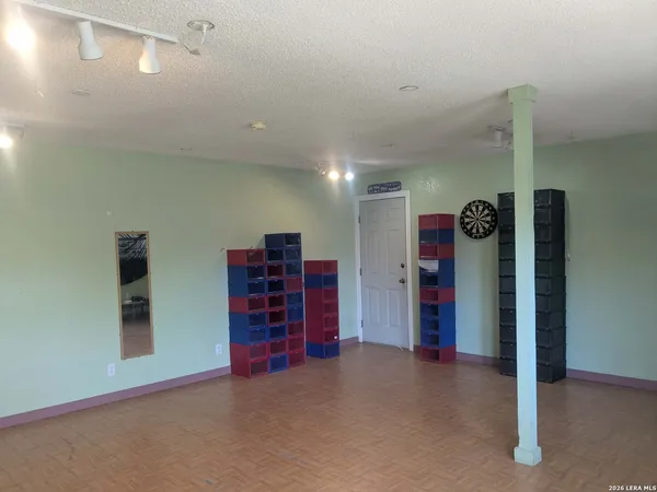 a view of empty room with furniture