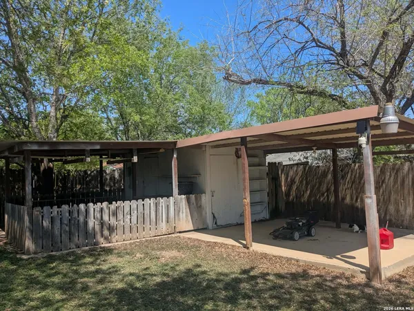 a view of a backyard of the house