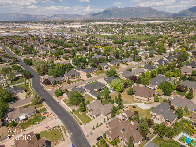 2327 Bluff Ridge Drive Syracuse, UT 84075 - Photo 63 of 66 Aerial perspective showcasing a residential neighborhood with varied architectural styles