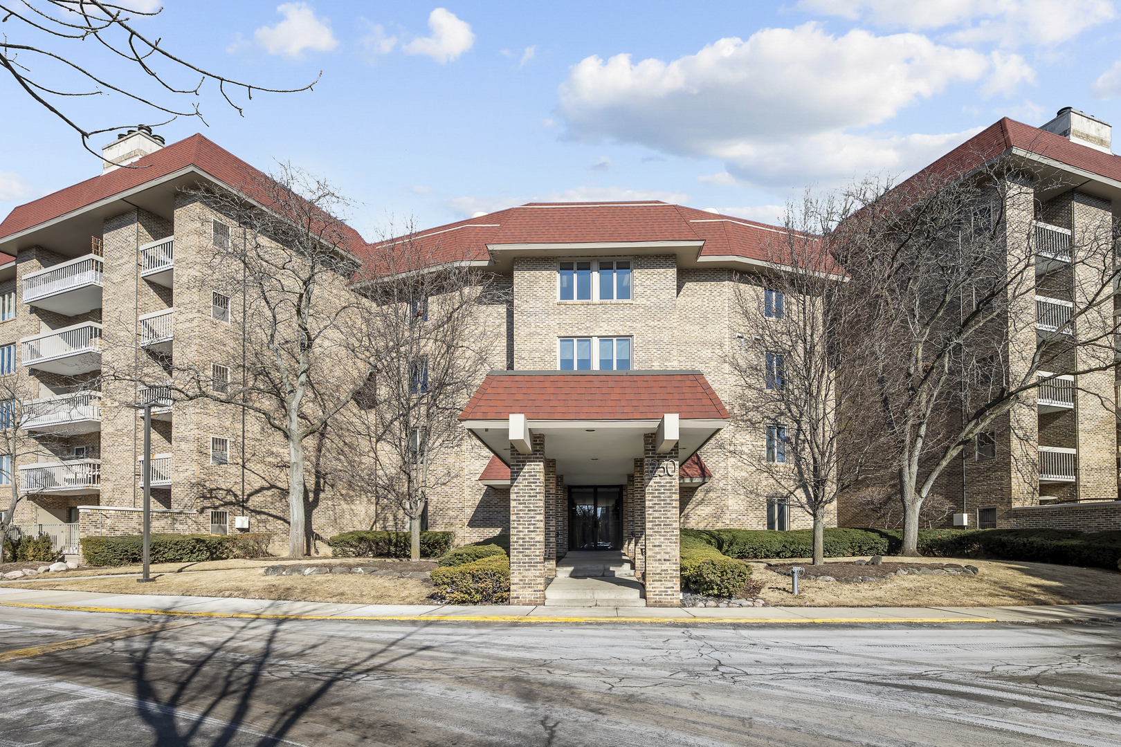 1250 Rudolph Drive, Unit 4F Northbrook, IL 60062 - Photo 1 of 15 a front view of a building