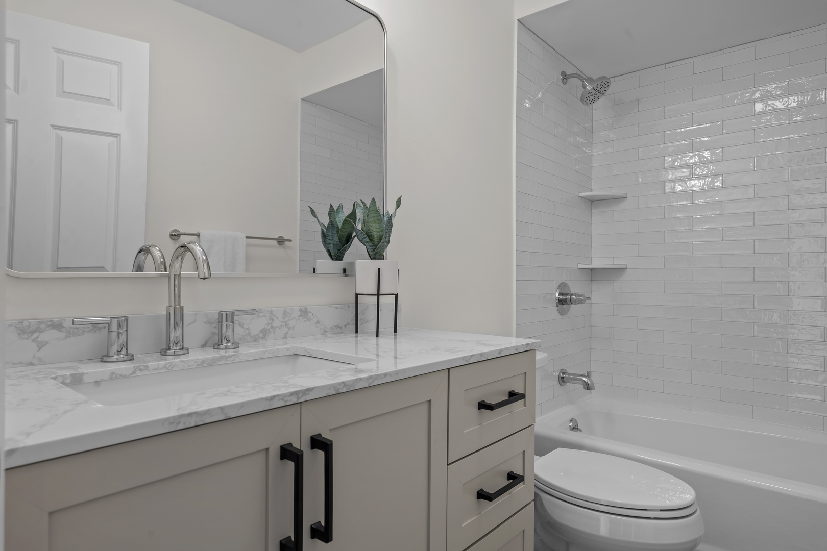 1250 Rudolph Drive, Unit 4F Northbrook, IL 60062 - Photo 11 of 15 a bathroom with a granite countertop sink a toilet and shower