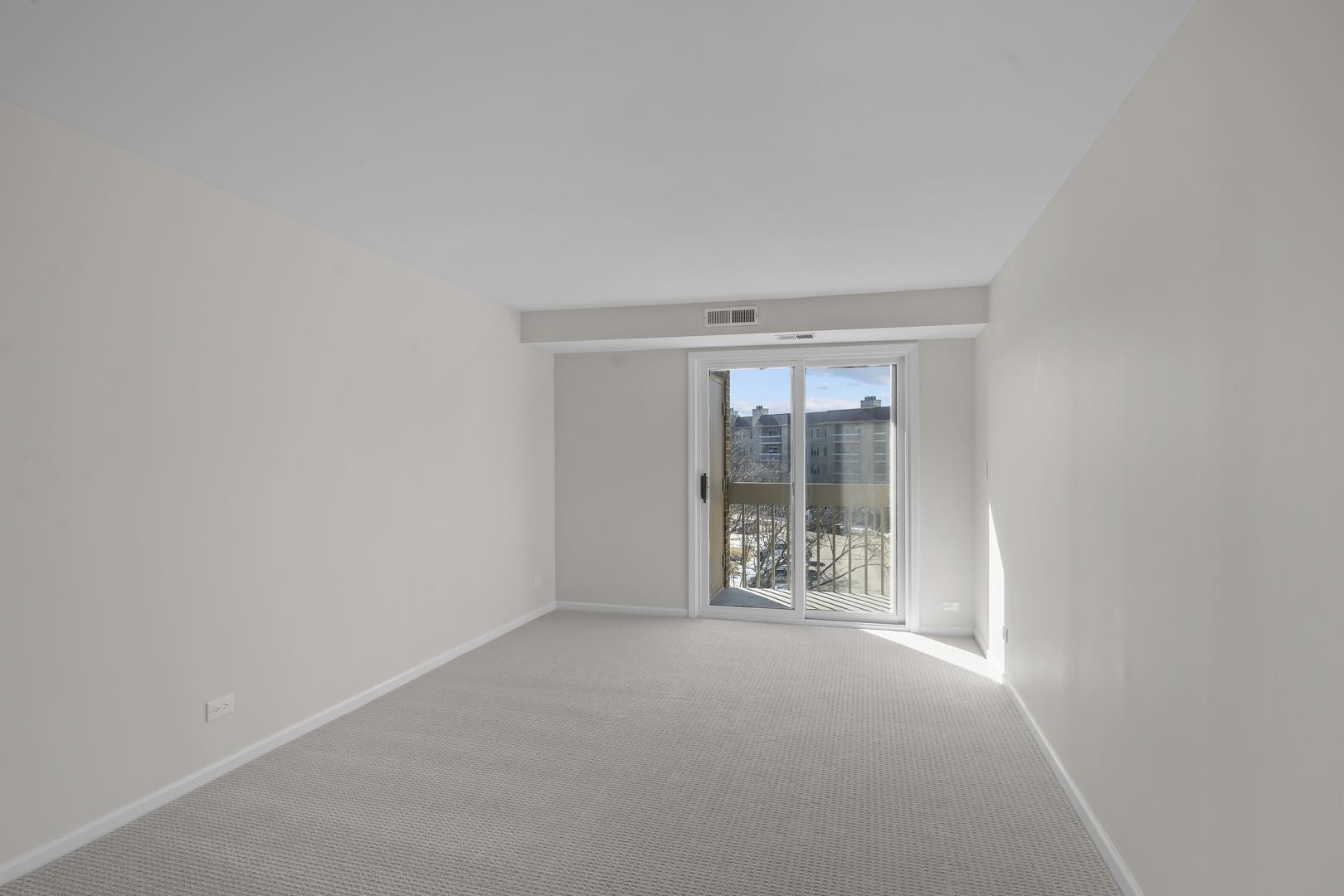 1250 Rudolph Drive, Unit 4F Northbrook, IL 60062 - Photo 12 of 15 an empty room with windows