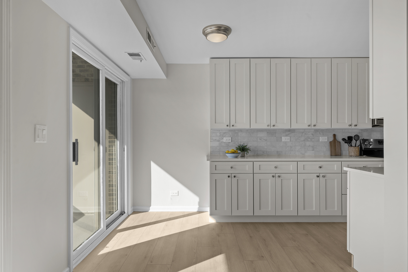 1250 Rudolph Drive, Unit 4F Northbrook, IL 60062 - Photo 4 of 15 a view of a kitchen with white cabinets