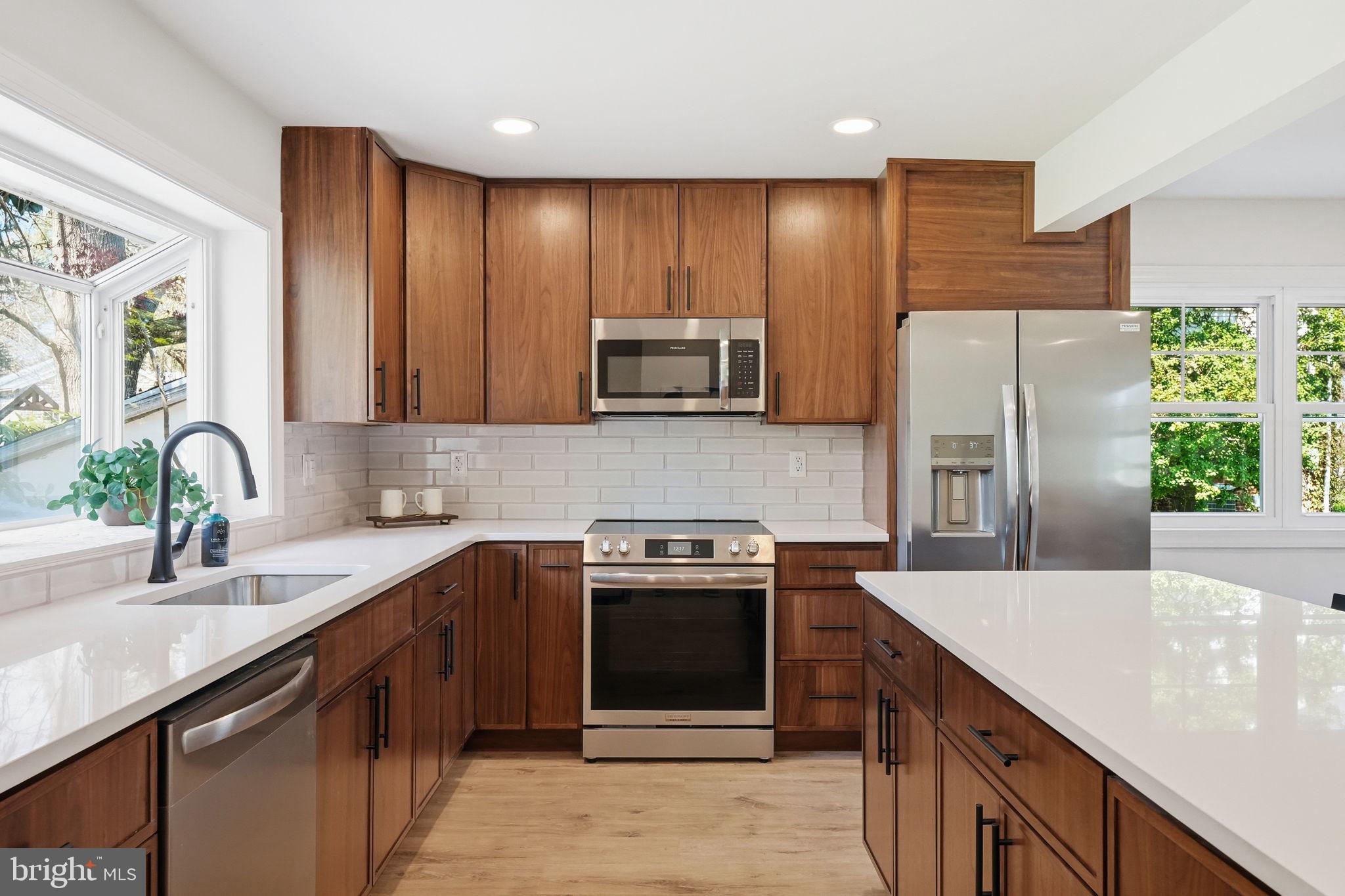 409 South Providence Road Wallingford, PA 19086 - Photo 37 of 106 Modern kitchen with warm wood tones.