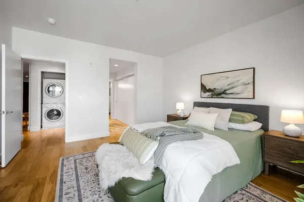 a bedroom with a bed and a couch