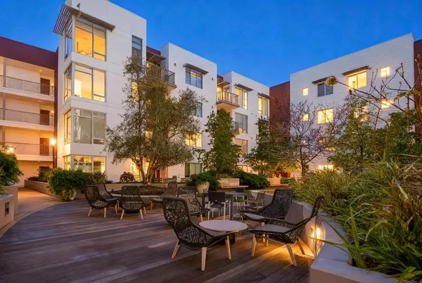 a view of a chairs and table in a patio