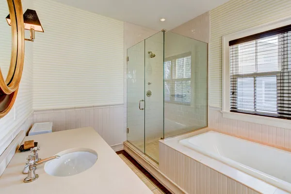 a bathroom with a tub and a sink