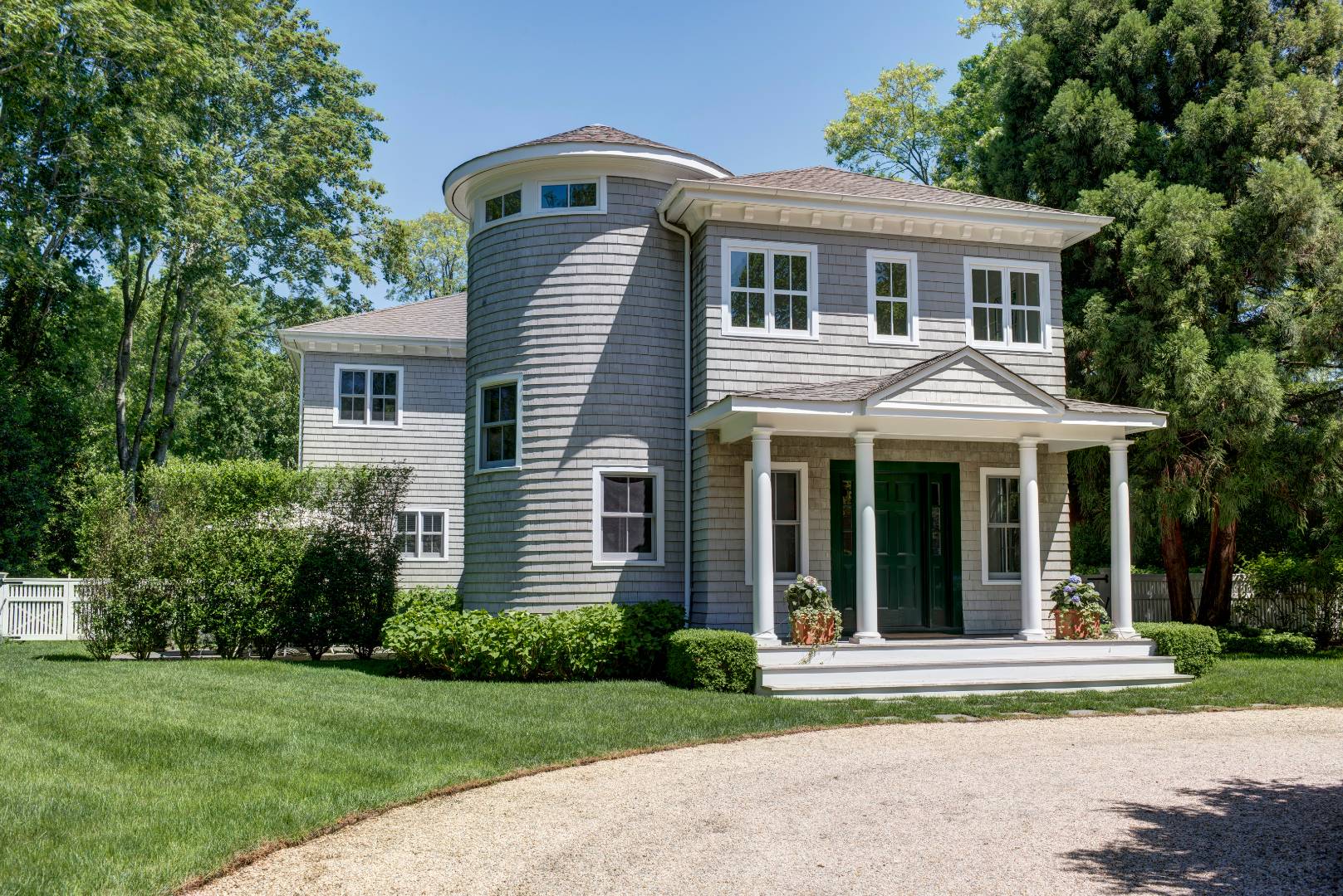 2654 Montauk Highway Bridgehampton, NY 11932 - Photo 18 of 19 a view of a white house with a small yard plants and large trees