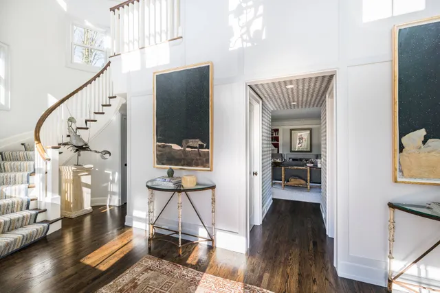 a view of living room and dining room with wooden floor