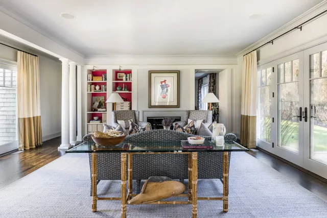 a room with lots of chairs and mirrors