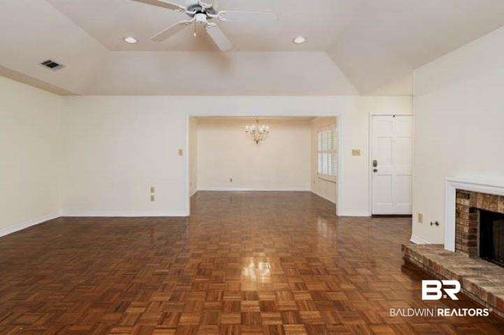 12 Stonebridge Court Mobile, AL 36608 - Photo 9 of 38 Unfurnished living room featuring a fireplace, a chandelier, ceiling fan, and recessed lighting