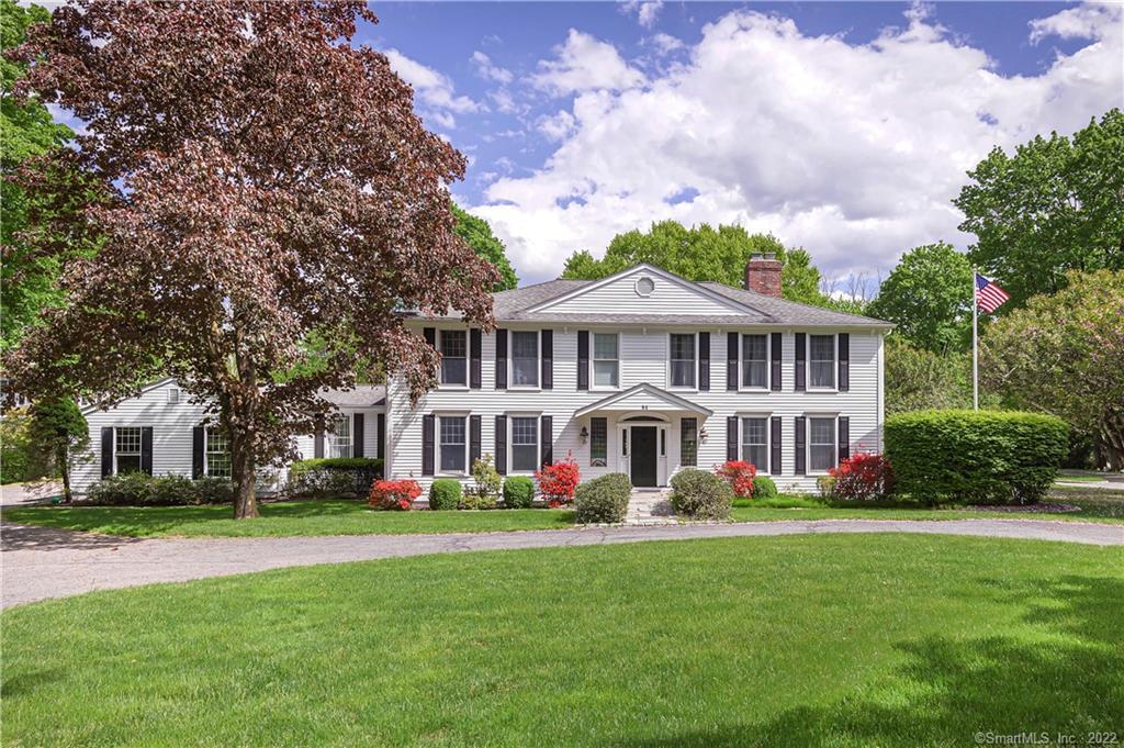 a front view of building with yard and green space