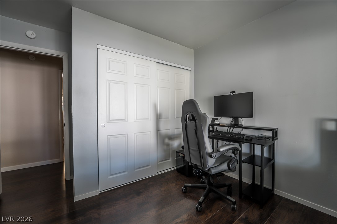 1324 Appaloosa Road Boulder City, NV 89005 - Photo 28 of 42 Functional home office or guest room with dark wood flooring and ample closet space.
