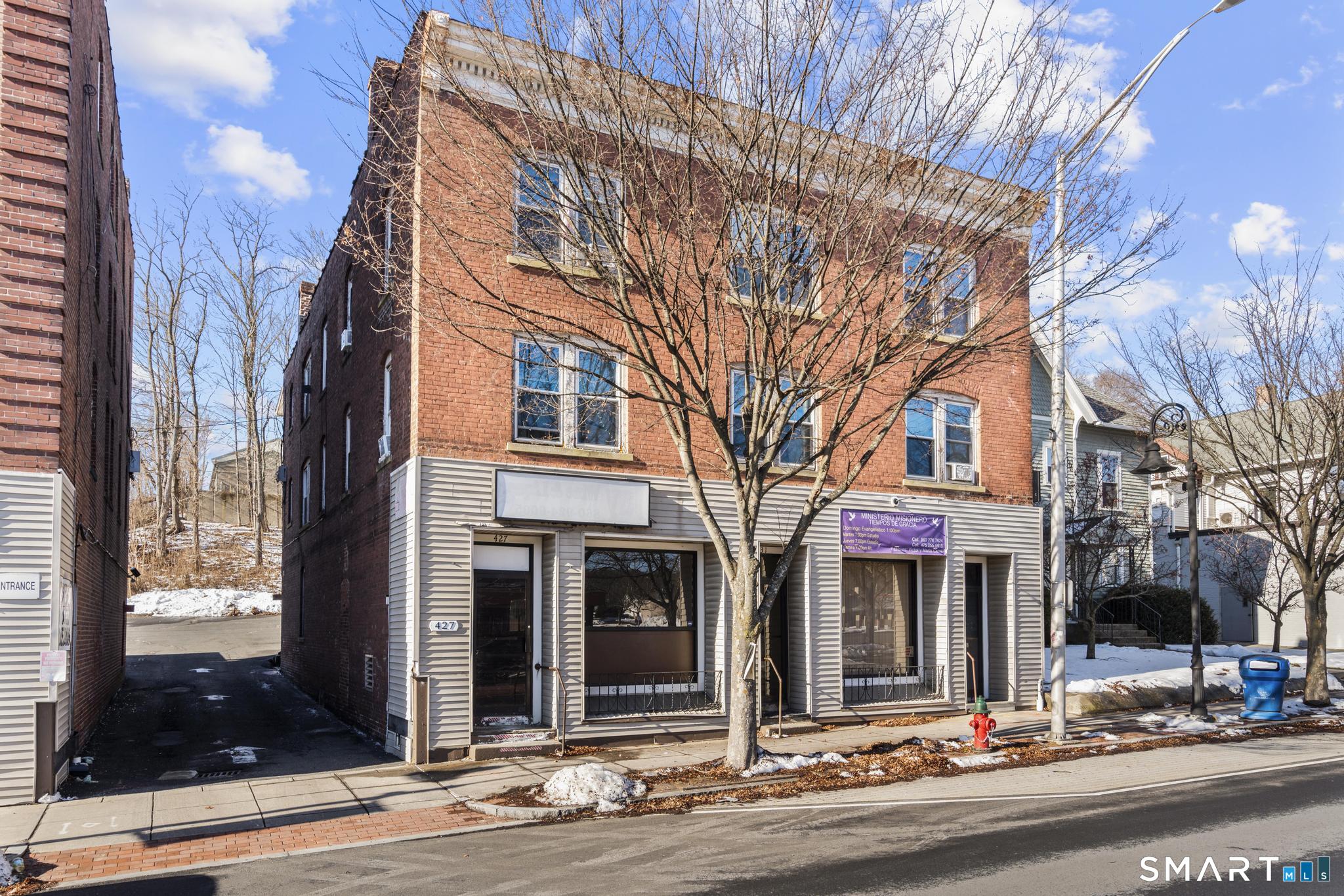 a view of a building with a street