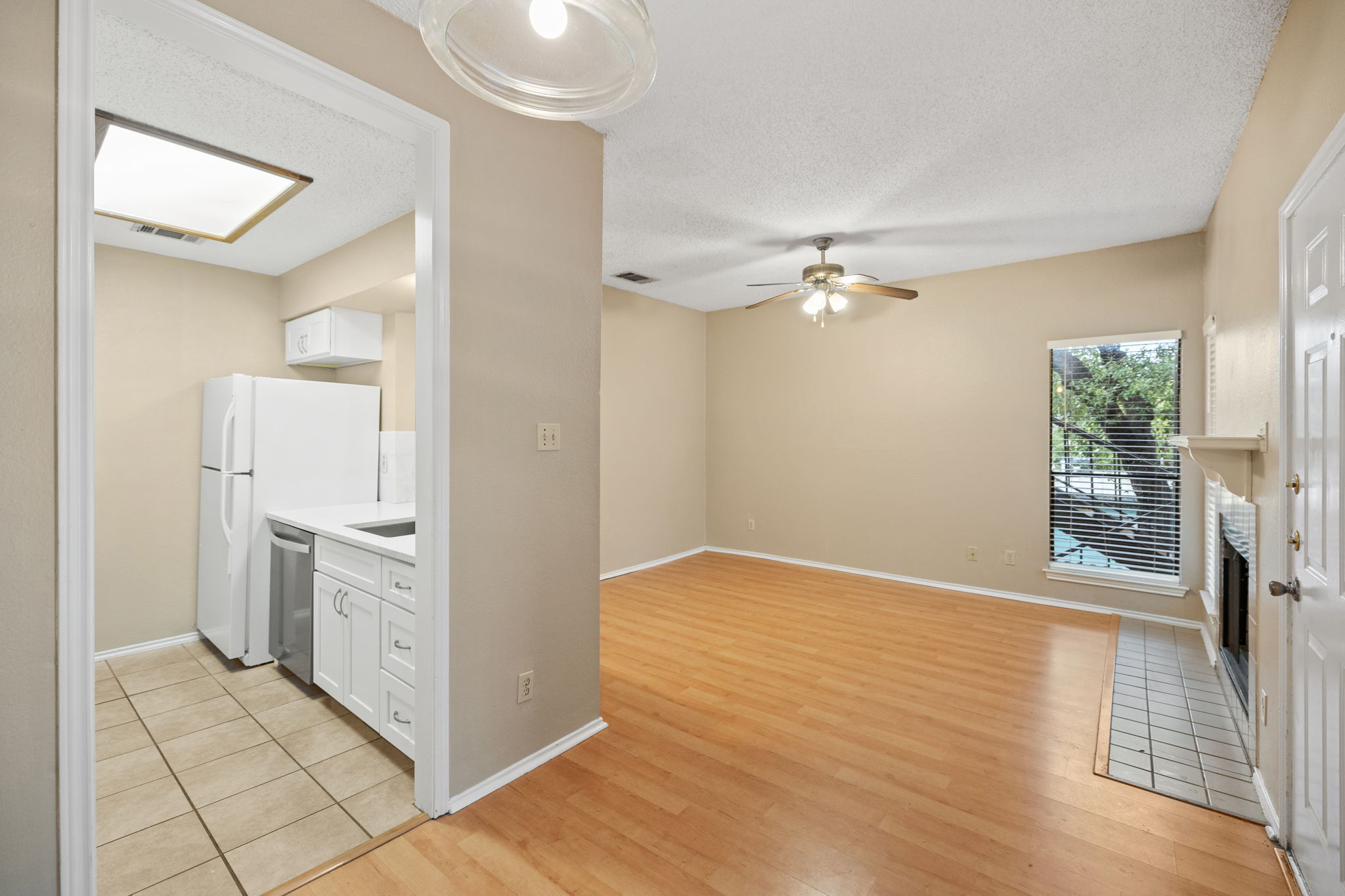 2706 Salado Street, Unit 210 Austin, TX 78705 - Photo 11 of 32 a view of a hallway with wooden floor and a living room
