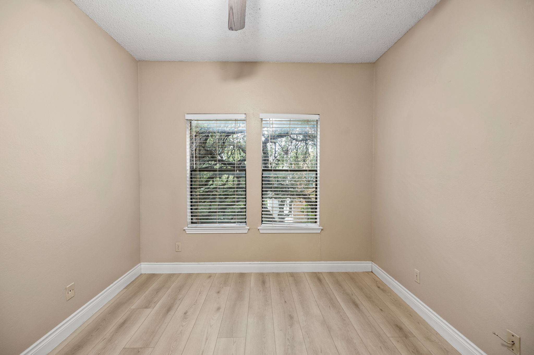 2706 Salado Street, Unit 210 Austin, TX 78705 - Photo 19 of 32 an empty room with a window